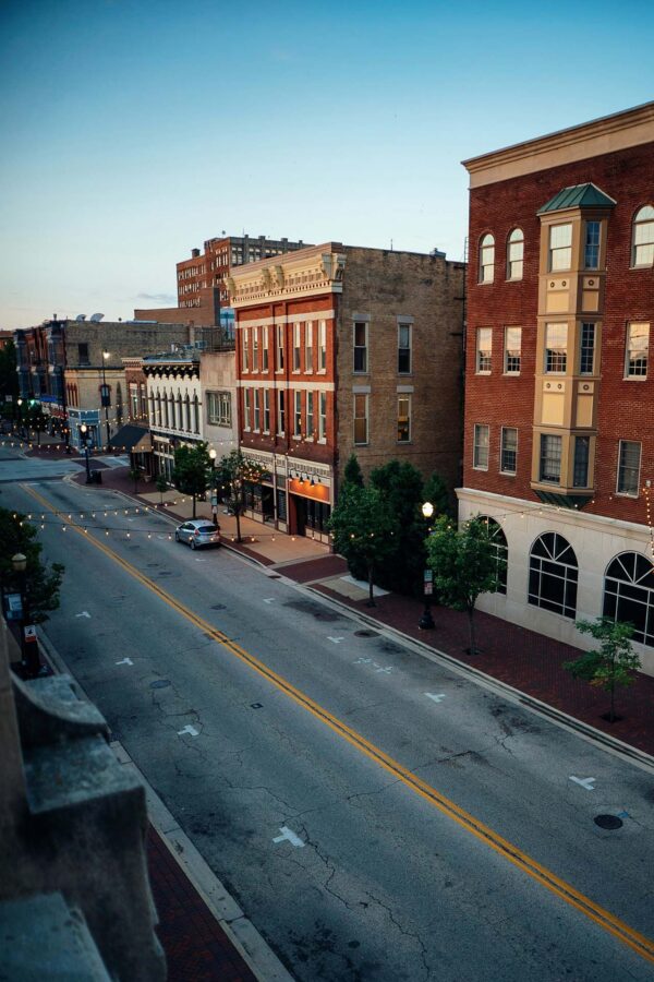 Classic street with red brick buildings.