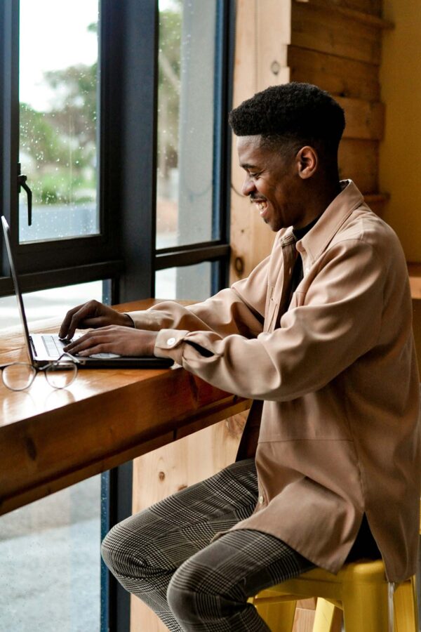 Person working on laptop computer at cafe.